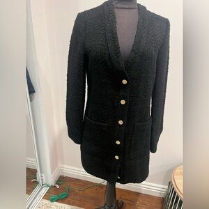 Zara’s long cardigan features a classic design